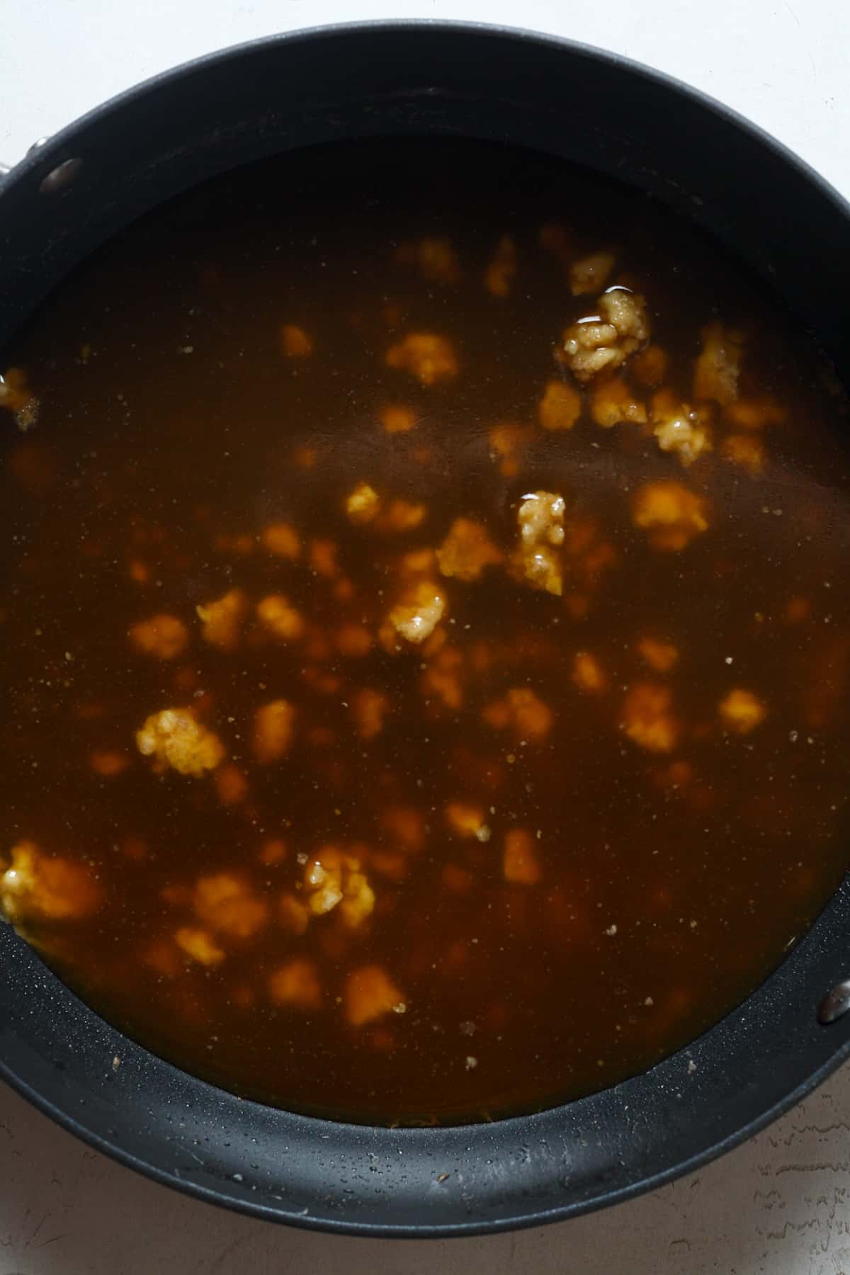 Homemade gravy in pan.