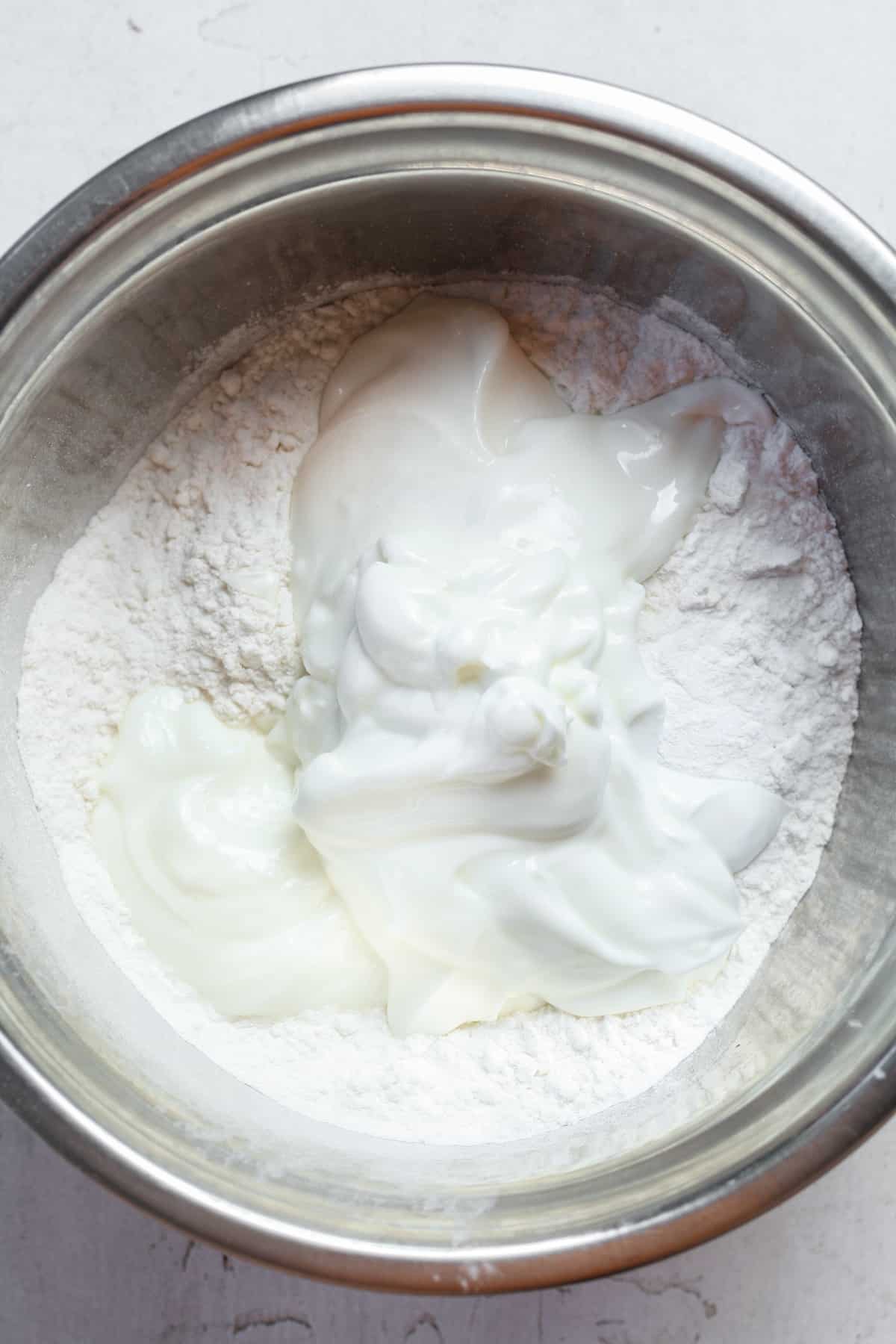 Yogurt and flour in bowl.