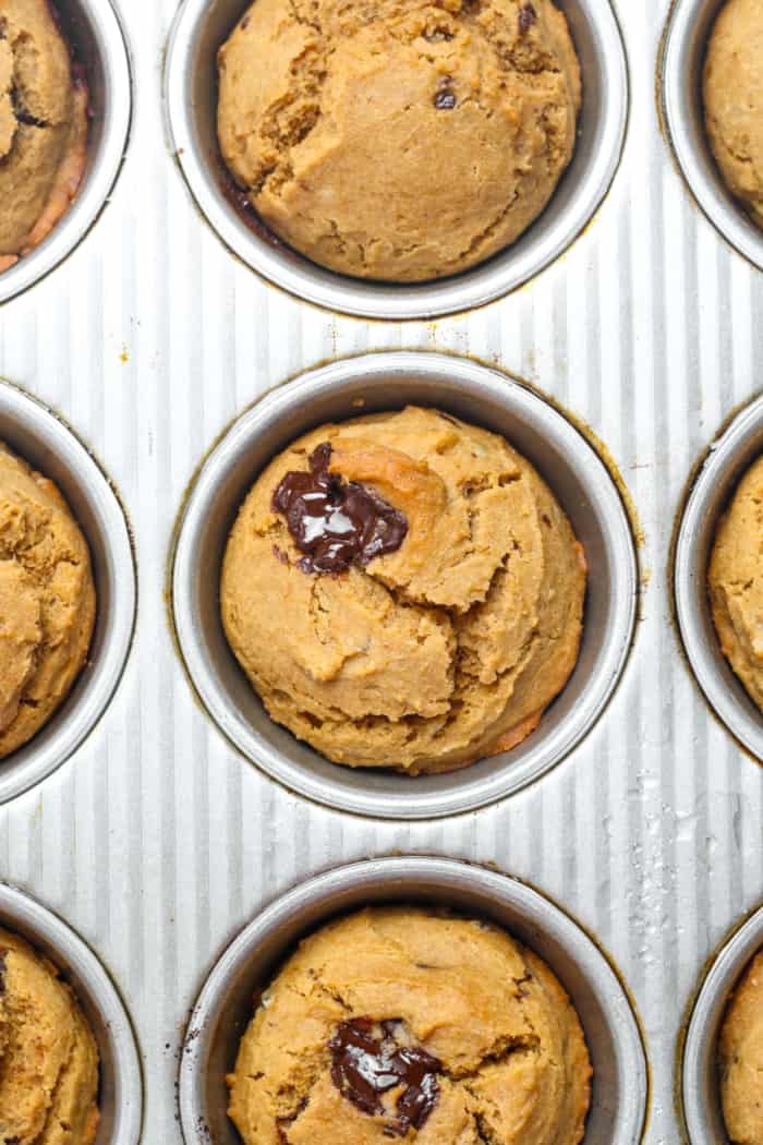 Baked muffins in silver pan.