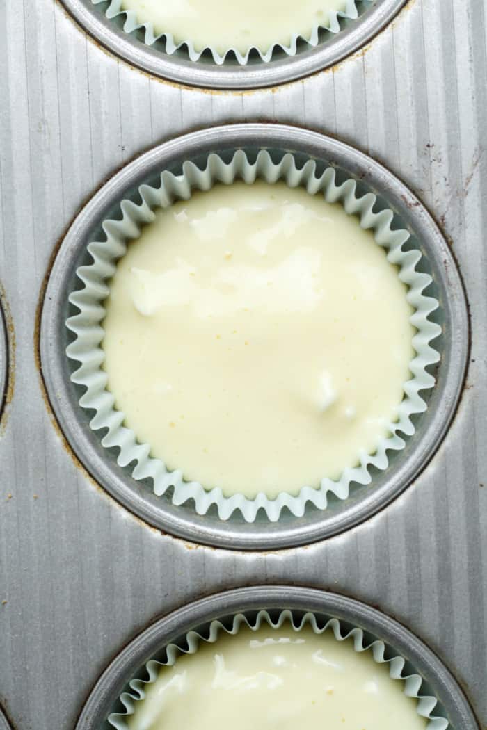 Raw cheesecakes in pan.
