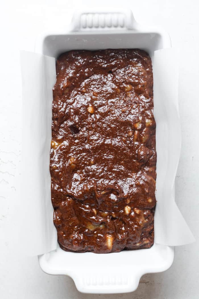 Loaf pan with chocolate batter.