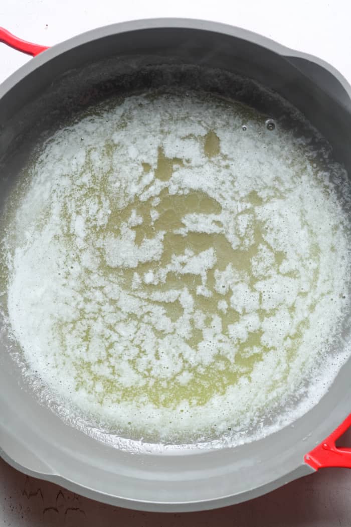 Melted butter in pan.