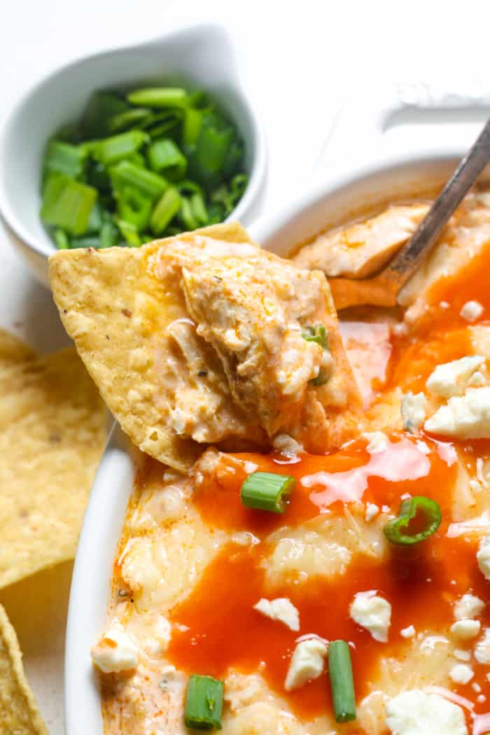 Chip with spicy chicken dip.