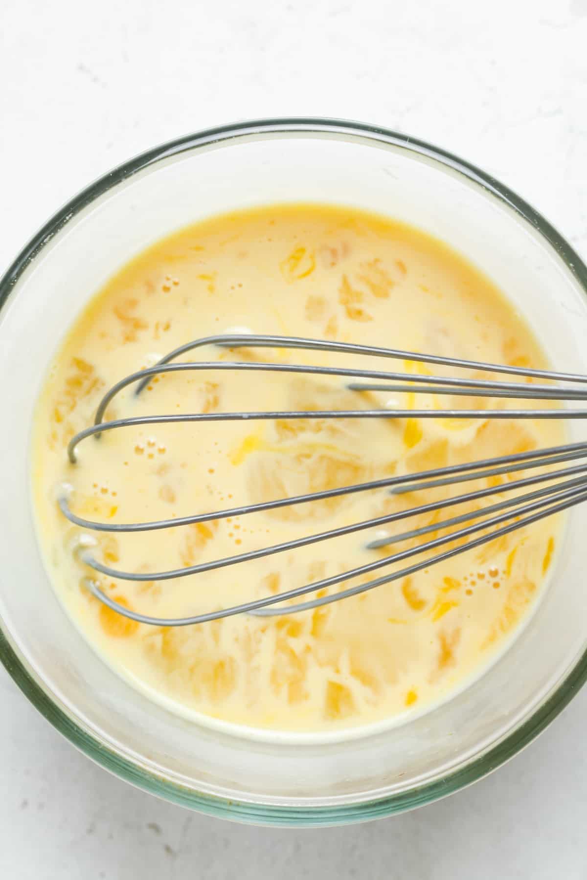 Whisked eggs in bowl.