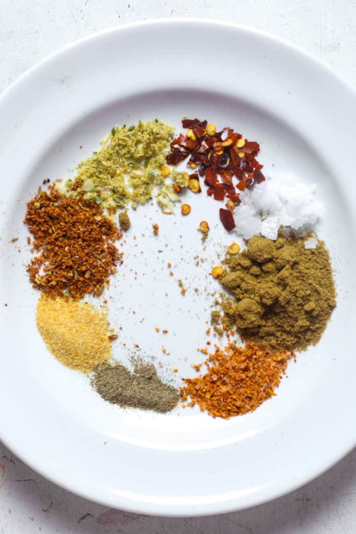 Spices on white plate.