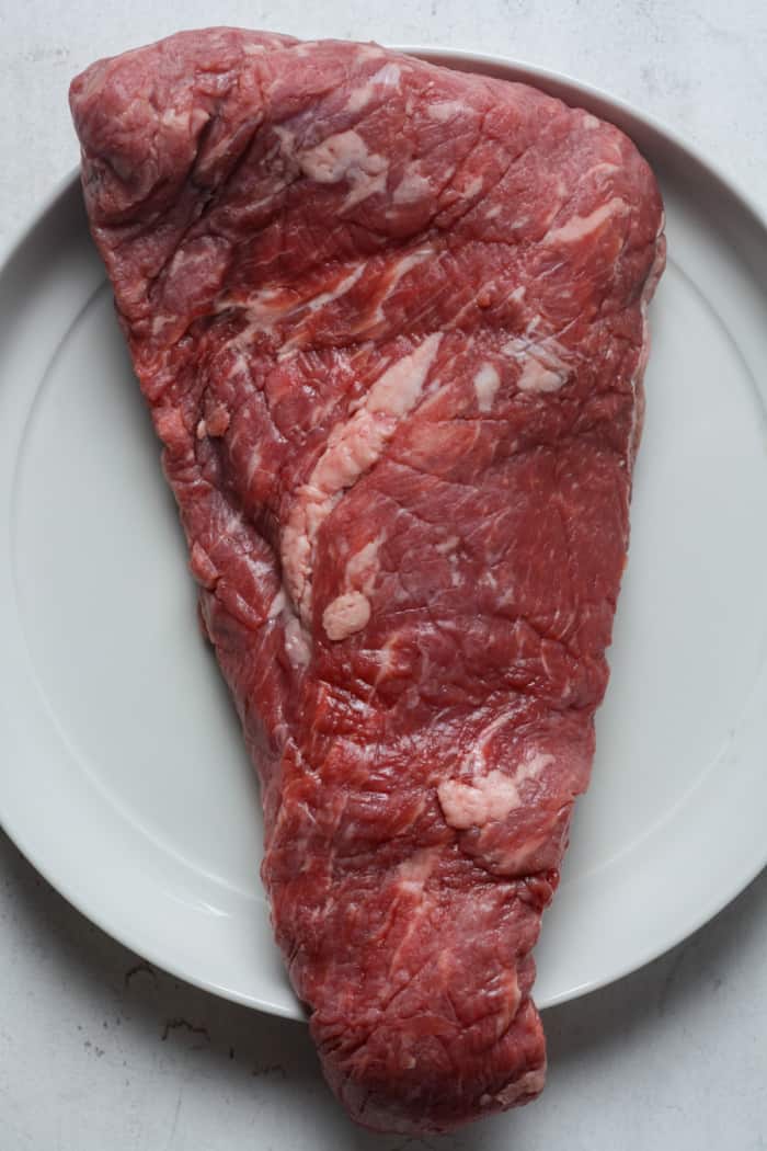 Tri tip steak on plate.