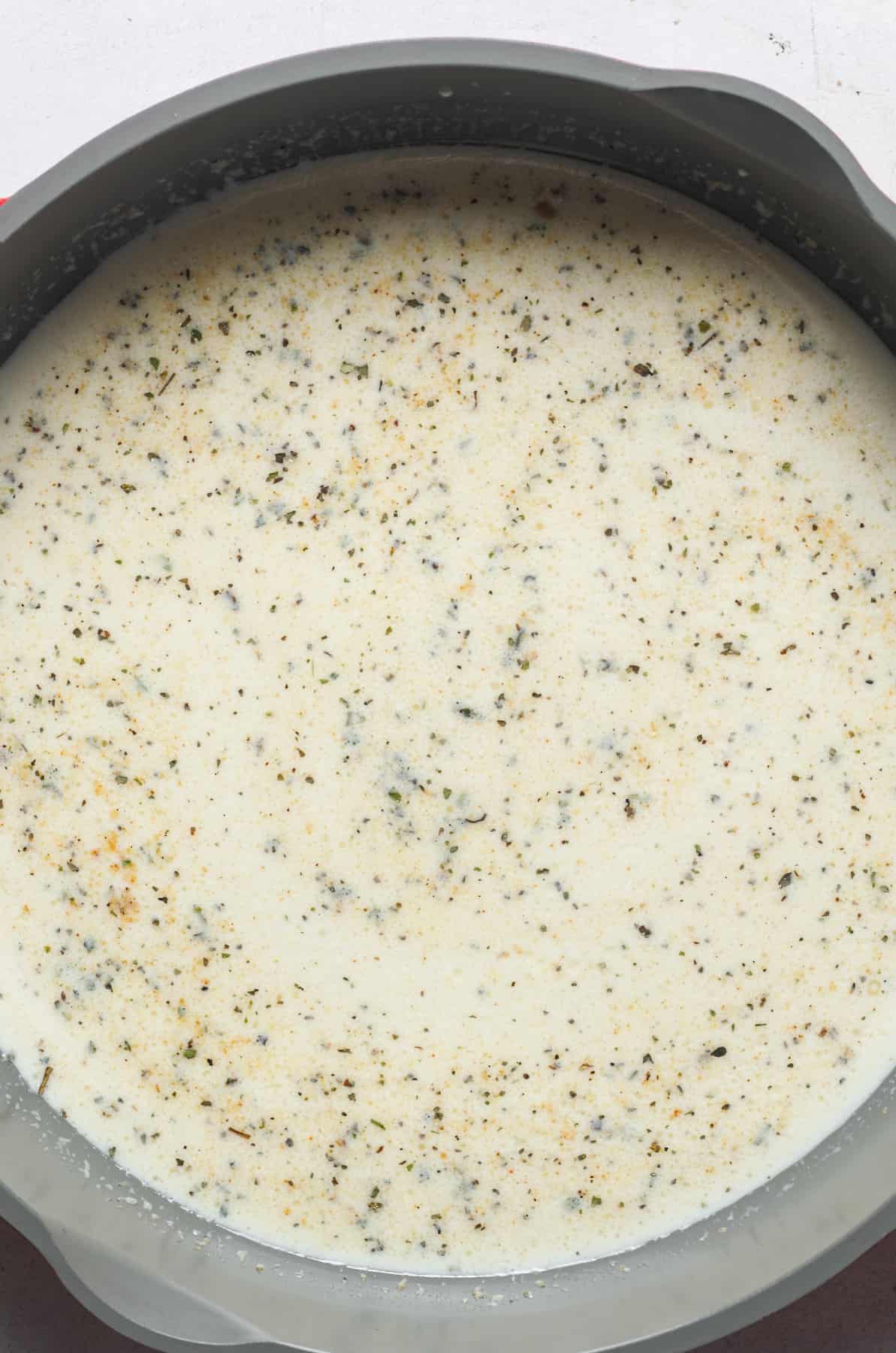 Creamy sauce in pan.