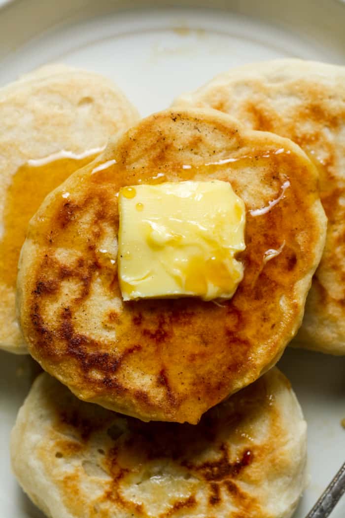 Buttery gluten free pancakes on plate.