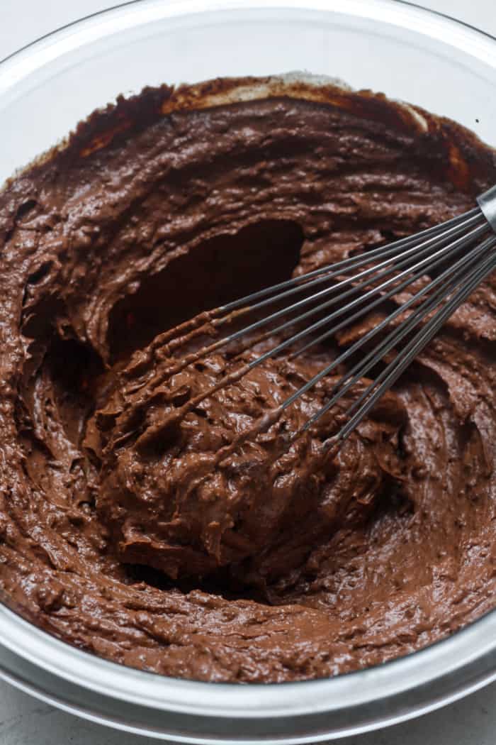 Thick brownie batter in bowl.