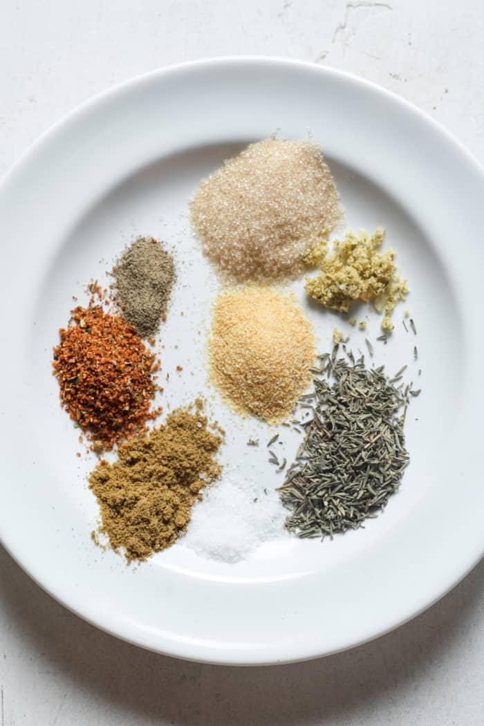 Spices on white plate.