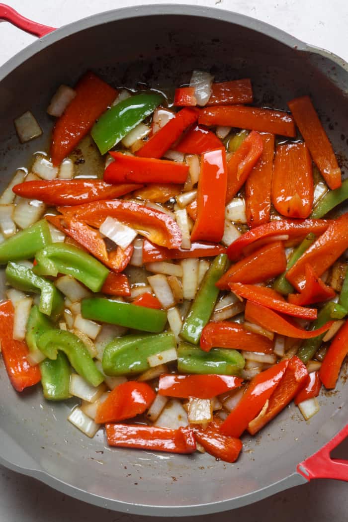 Peppers and onions in skillet.