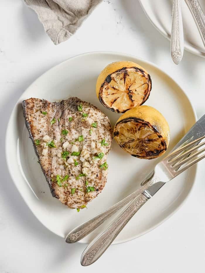 Fish steak on plate.