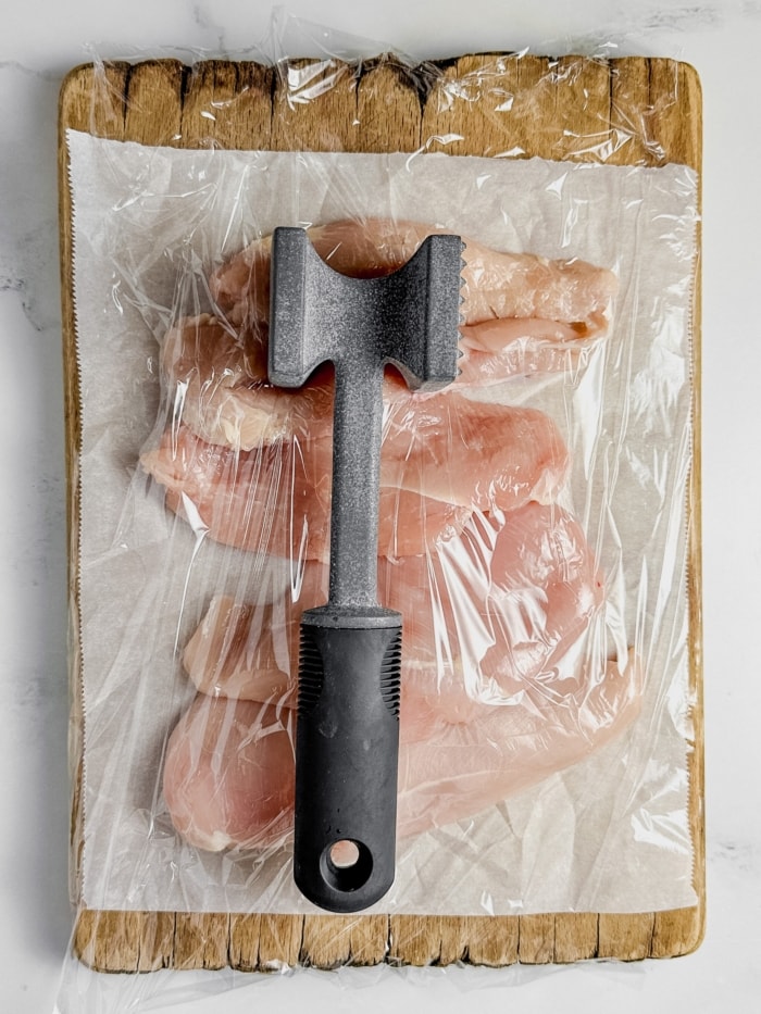 Meat mallet with chicken.