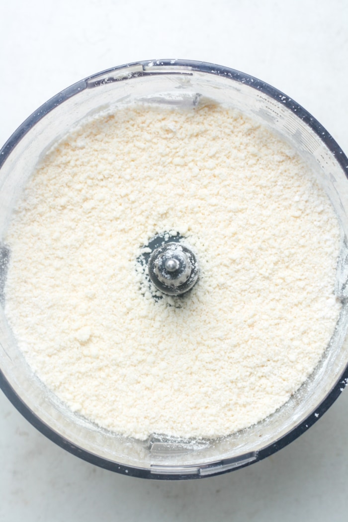 Crumbly mixture in food processor.