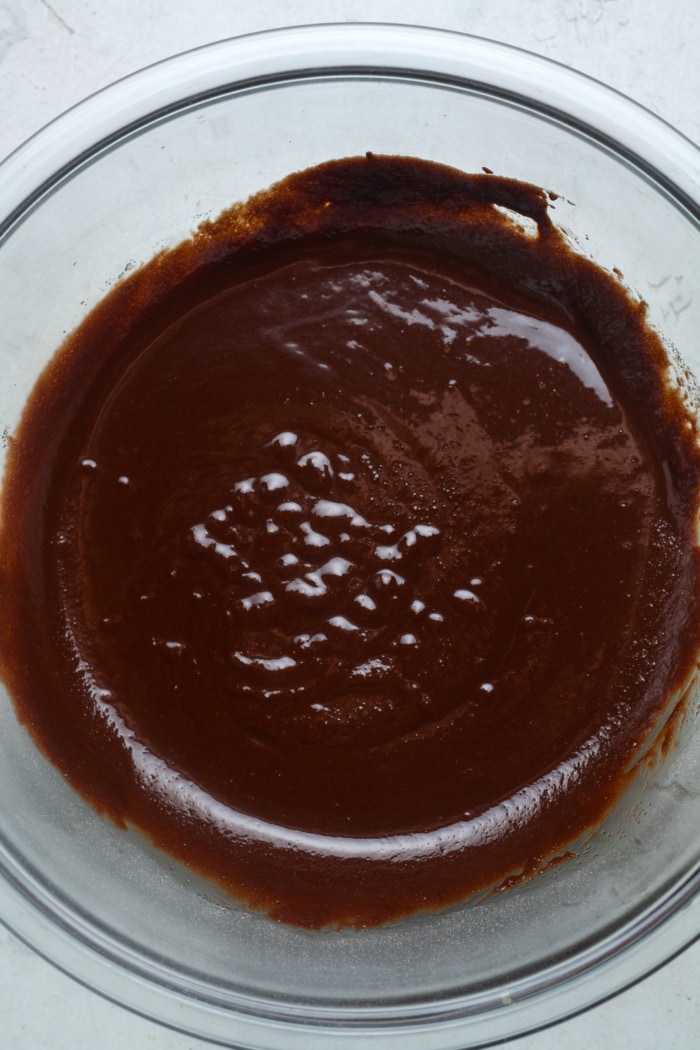 Chocolate batter in glass bowl.