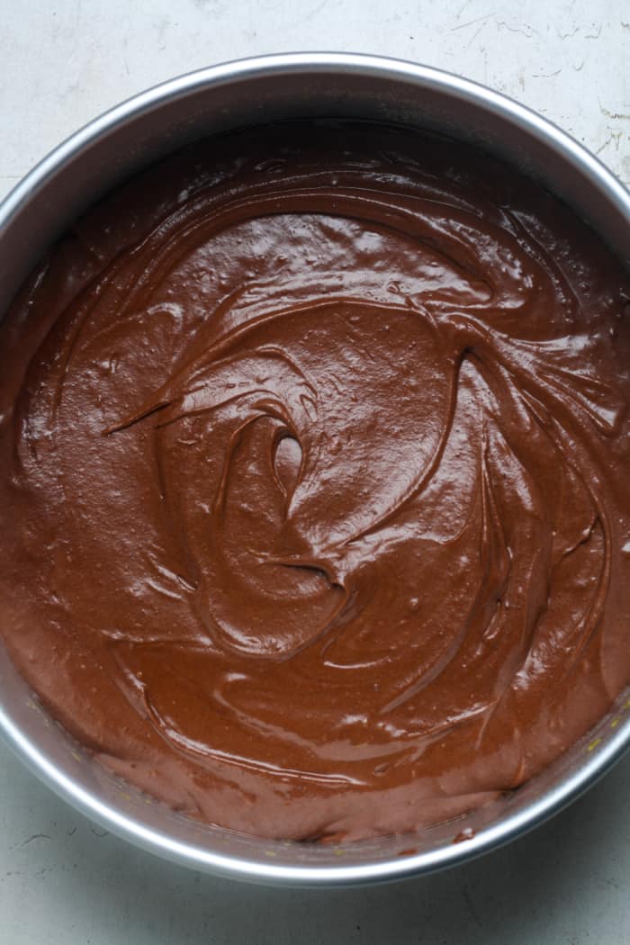 Springform pan with chocolate batter.