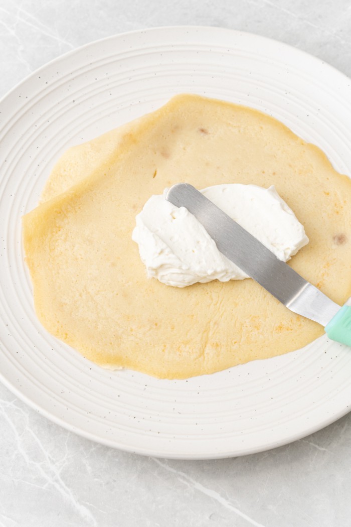 Crepe with whipped cream.