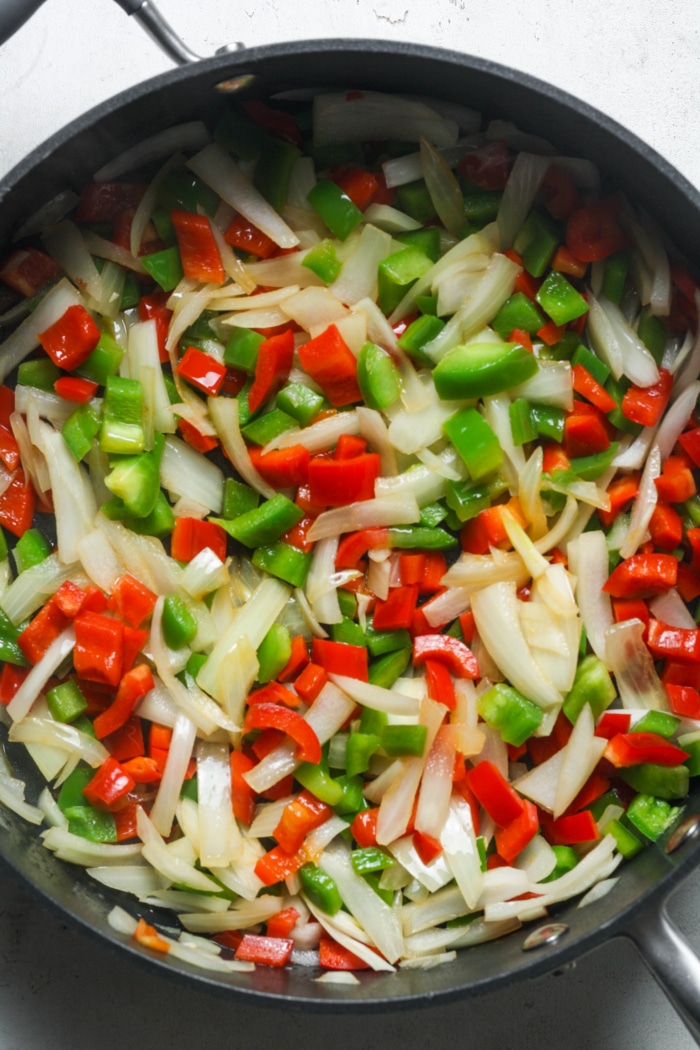 Onions and peppers in skillet.
