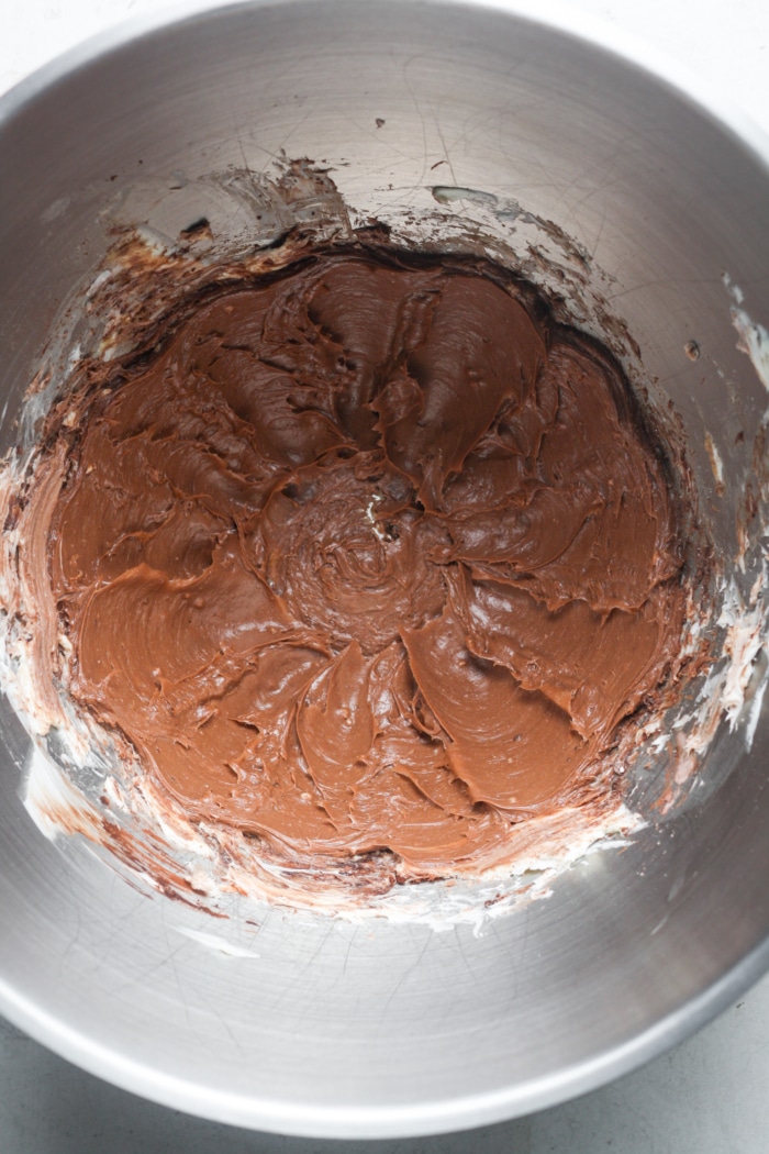 Chocolate frosting in bowl.