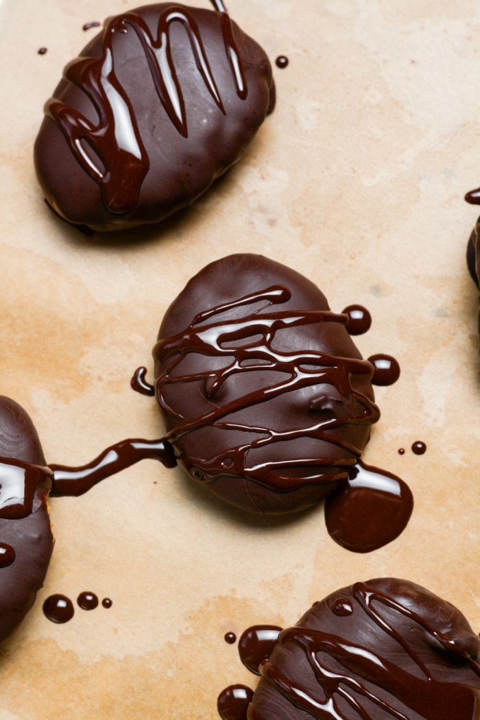 Chocolate drizzled Easter eggs.