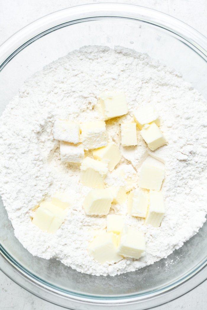Cubed butter in bowl.