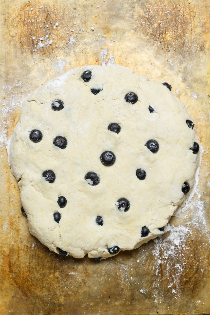 Round dough ball with blueberries.