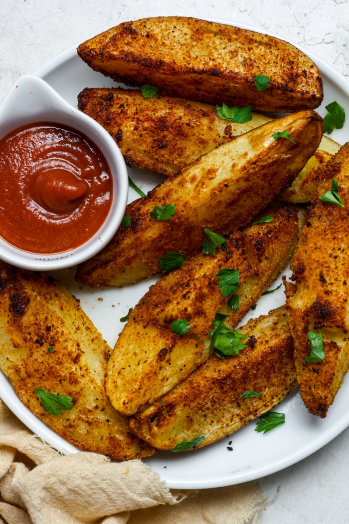 Plate of crispy potato wedges.