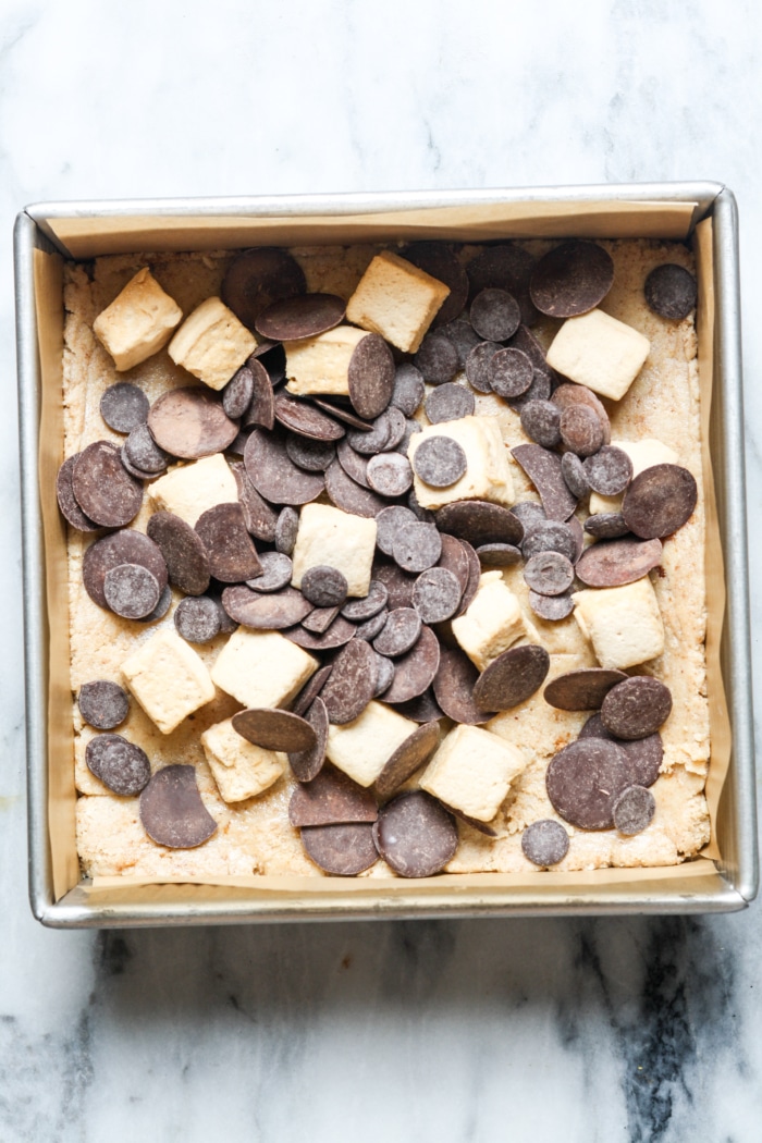 Marshmallows and chocolate in pan.
