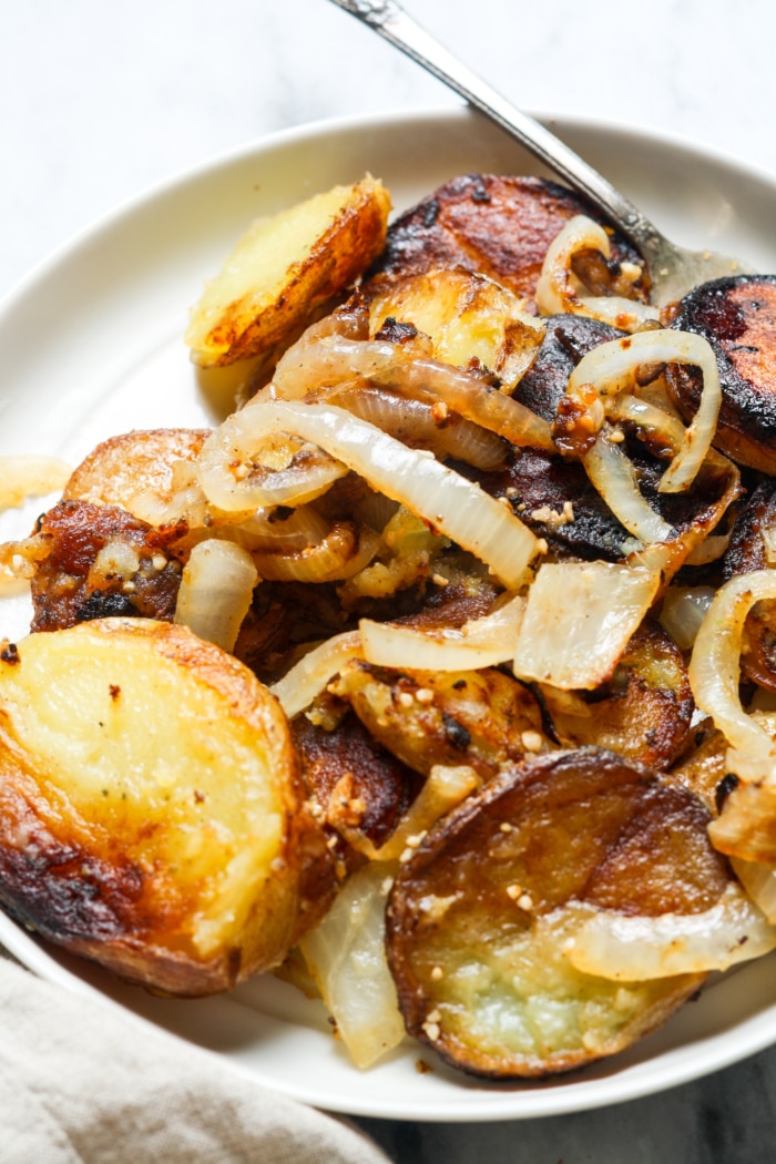 Close up of potatoes with onions.