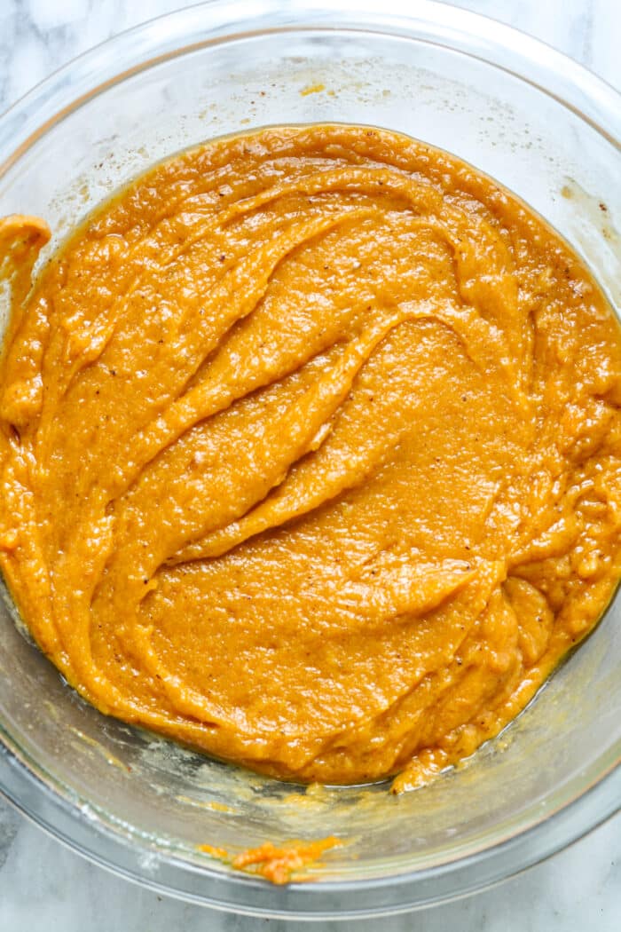 Pumpkin batter in glass bowl.