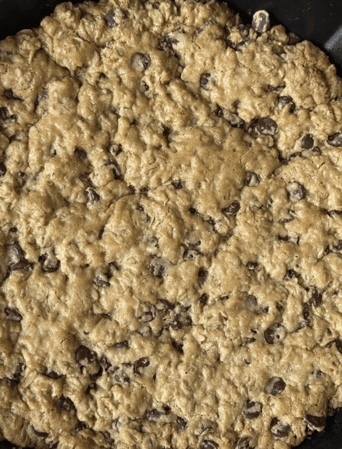 Close up of giant oatmeal chocolate chip cookie.