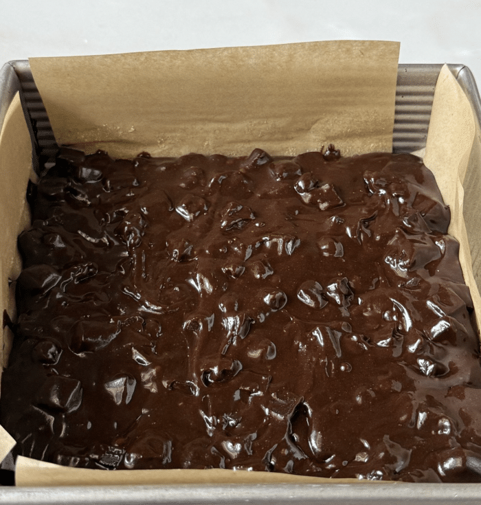 Brown batter in square pan.
