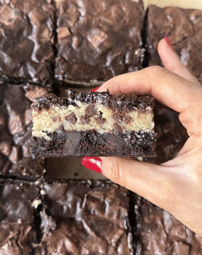 Cookie dough in the middle of brownies.