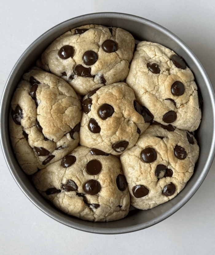 Balls of baked dough in cake pan.