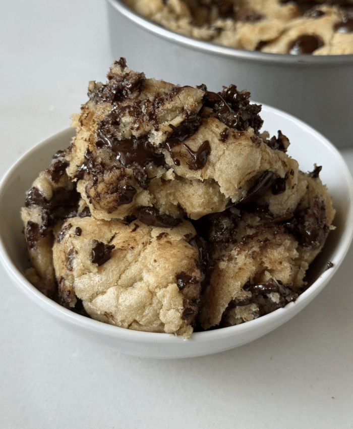 White bowl of cookie chunks.