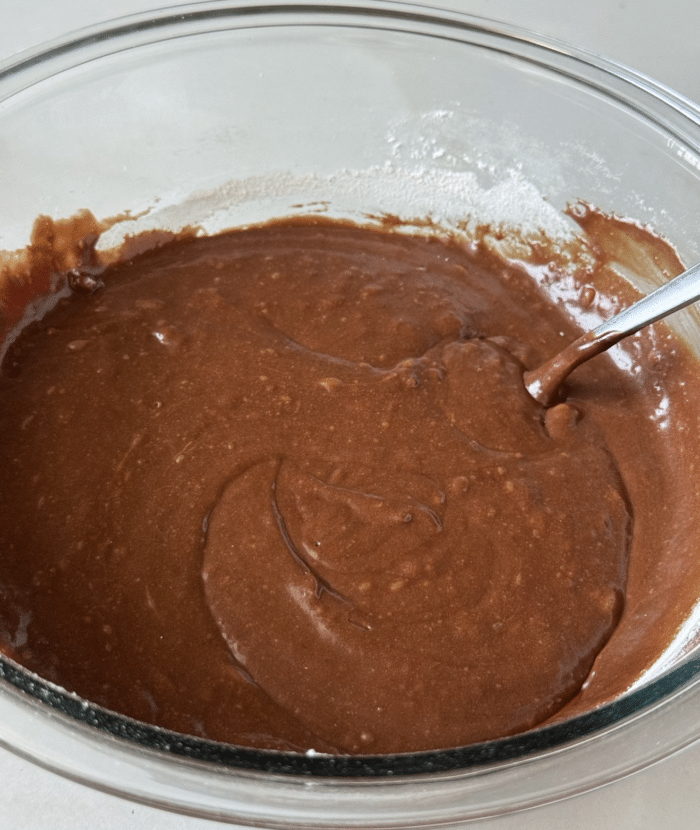 Brown batter in glass bowl.