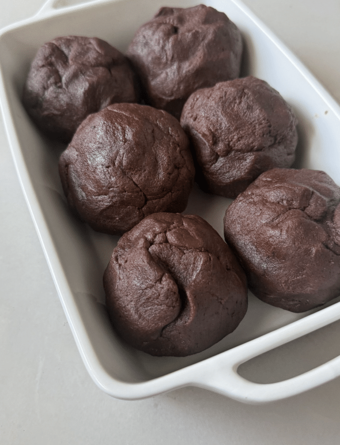 Brownie scoops in pan.