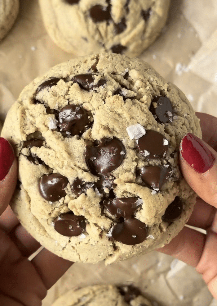 Hands with gooey cookies.