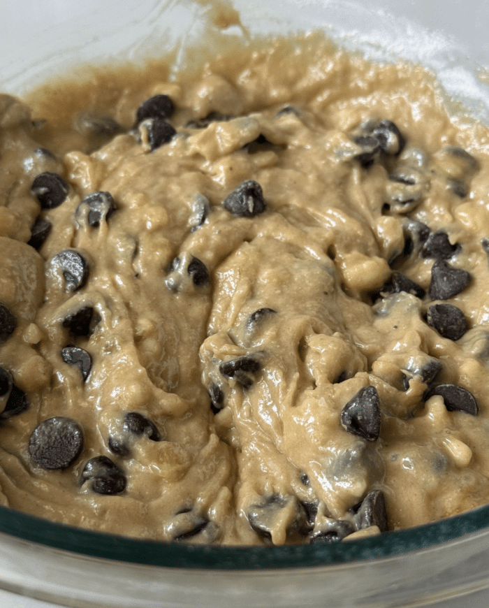 Banana batter in glass bowl.