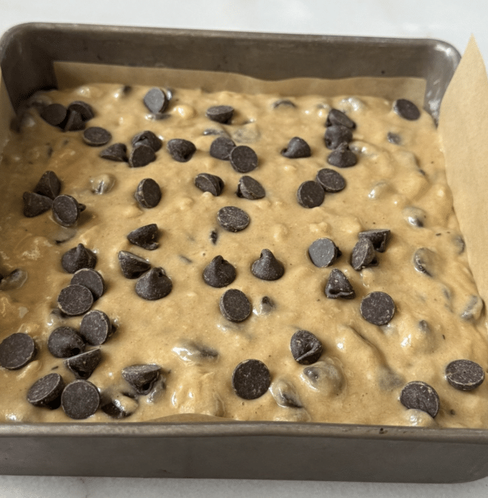 Square pan with yellow batter.