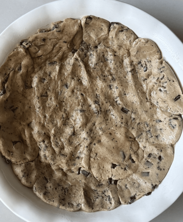 Pie plate with cookie dough.