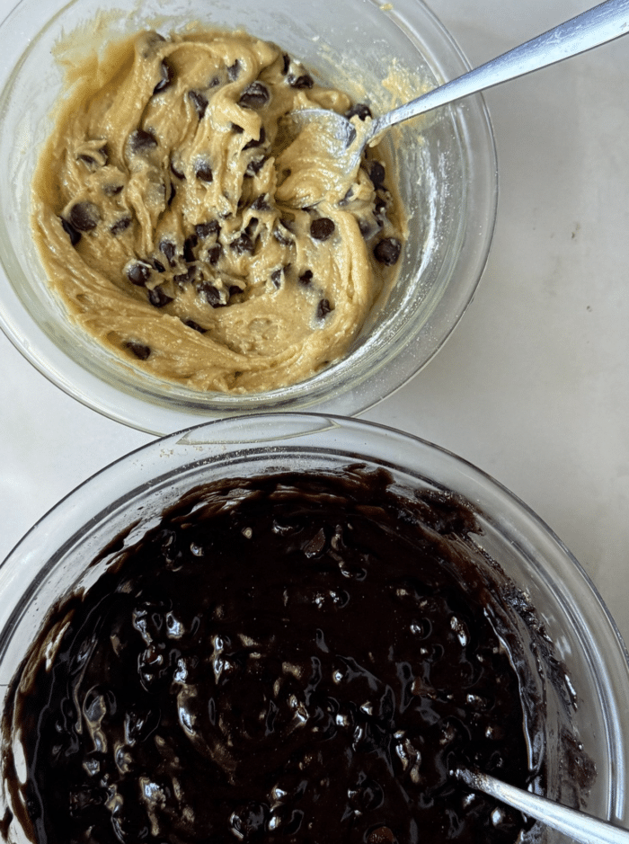 Bowls with cookie dough and brownie batter.