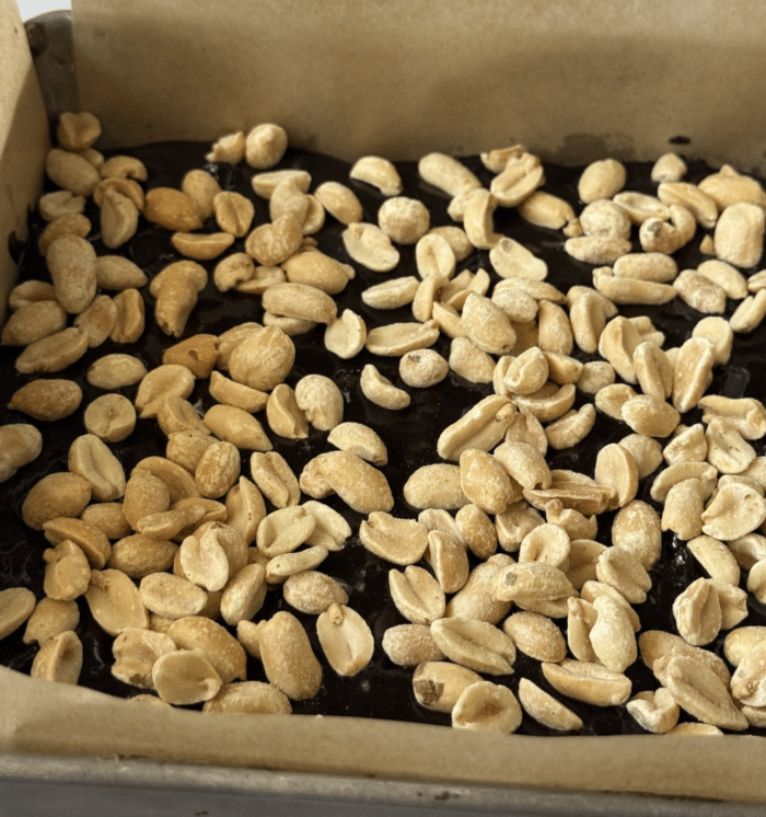 Peanuts in metal pan.