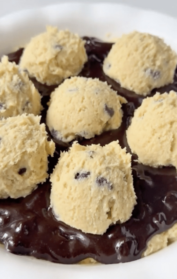 Scoops of dough with batter.