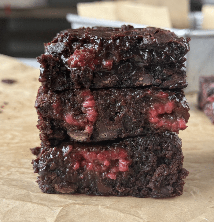 Gooey brownies with raspberries.