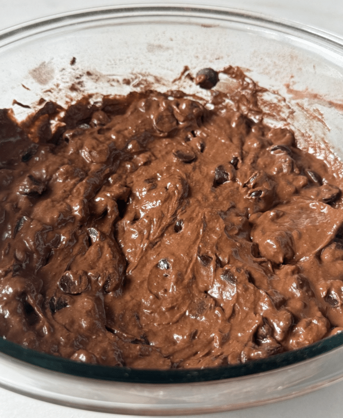 Dark batter in glass bowl.