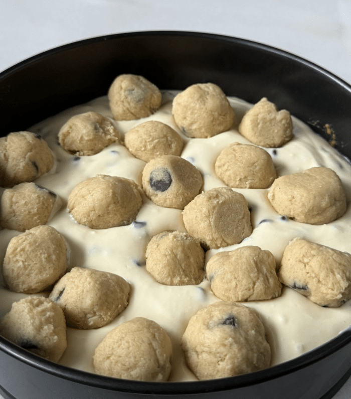Cookie dough balls in pan.