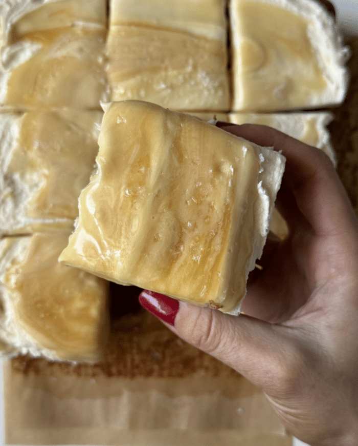 Thick frosting with hand.