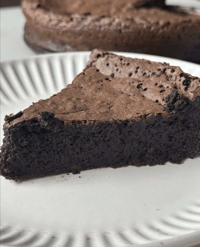 Flourless cake on plate.