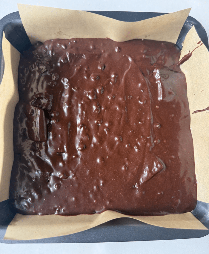 Dark batter in square pan.